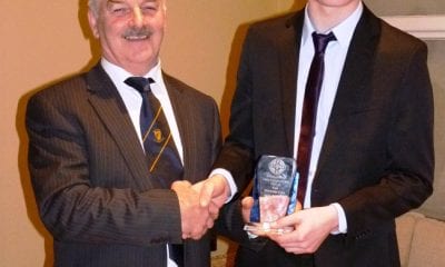 Silverbridge Club Chairman John Murphy presents Jarly Og Burns with a merit award in recognition of his second Colleges All Star  