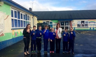 MLA Megan Fearon with Principal Lousie Campbell and pupils from Primary 7 in Killean PS