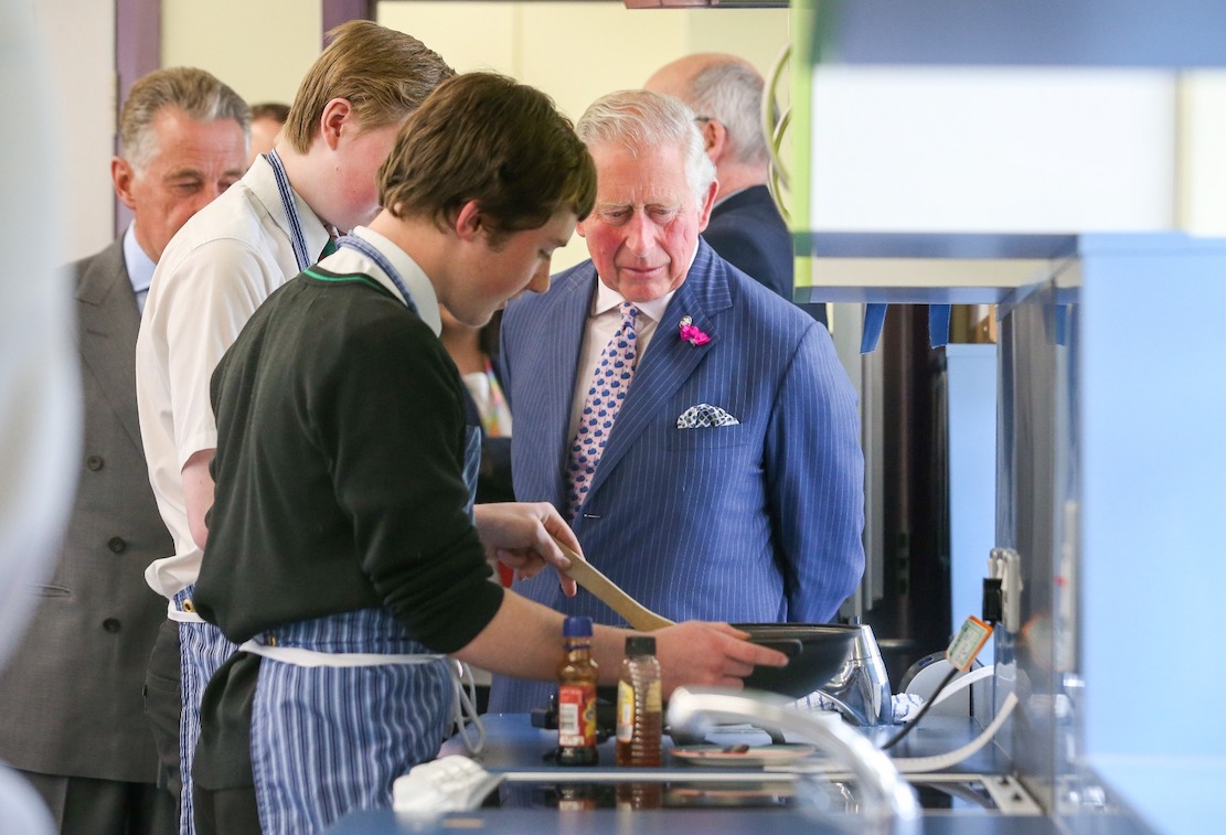 His Royal Highness The Prince of Wales met pupils at St. Patrick’s Grammar School in Armagh who are taking part in the Achieve programme run by his charity, The Prince’s Trust. Thomas Cullen (closed to the camera) and Cathan Kennedy demonstrate the cooking skills they have learned during the programme.