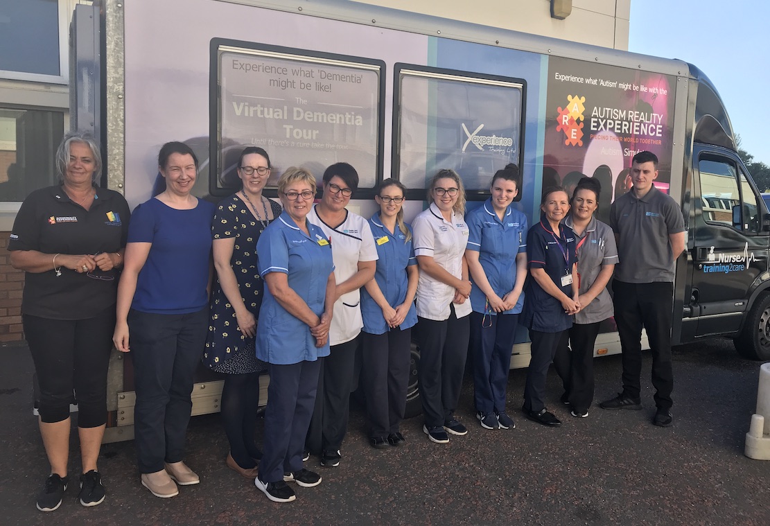 Dementia bus Daisy Hill: Some of those who took part in the virtual dementia experience at Daisy Hill Hospital with John Saunders from Dementia Xperience Training.
