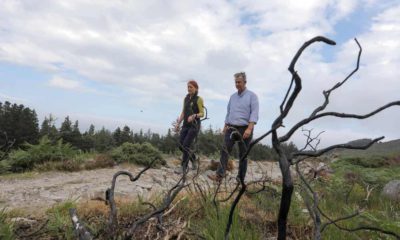 Minister Edwin Poots is pictured with Heather McLachlan, National Trust Director NI, at the site of the wildfire in the Mournes