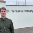 Alliance Councillor Peter Lavery outside St Teresa's Primary School