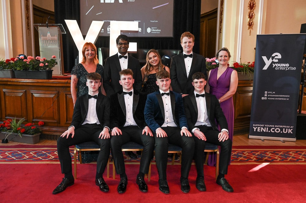 Young Enterprise Southern Company of the Year 2023, Enlighten, with (back left) Judith Totten, Chair, Young Enterprise and Paul Narain, US Consul General in Belfast; and (back right) Joe Kennedy III, US Special Envoy to Northern Ireland for Economic Affair; and Carol Fitzsimons MBE, CEO, Young Enterprise.