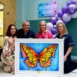 This lovely piece of artwork called ‘Butterfly Niamh’ was created by Ella Hamilton and donated to the Butterfly Suite in Memory of Baby Niamh Armitage. Niamh’s parents are pictured with the artwork alongside Nicola-Ann Henderson (Consultant) and Mary Dawson (Lead Midwife).
