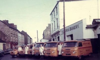 The orange delivery vans of McCann’s Bakery were a familiar sight in Newry, south Armagh and south Down in the 1960s. They are shown here, with the bread servers, in front of the Bakery building before Castle Street was demolished in the late 1960s.