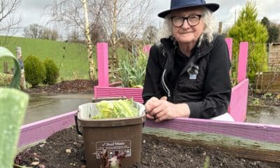 Donaghcloney man Walter Ferris pictured with his food caddy at the Donaghcloney Community Garden where compost made from food waste is used to grow vegetables.